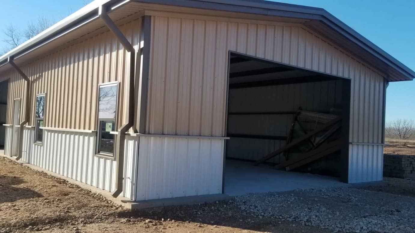 barndominium tan metal shop house open bay rural
