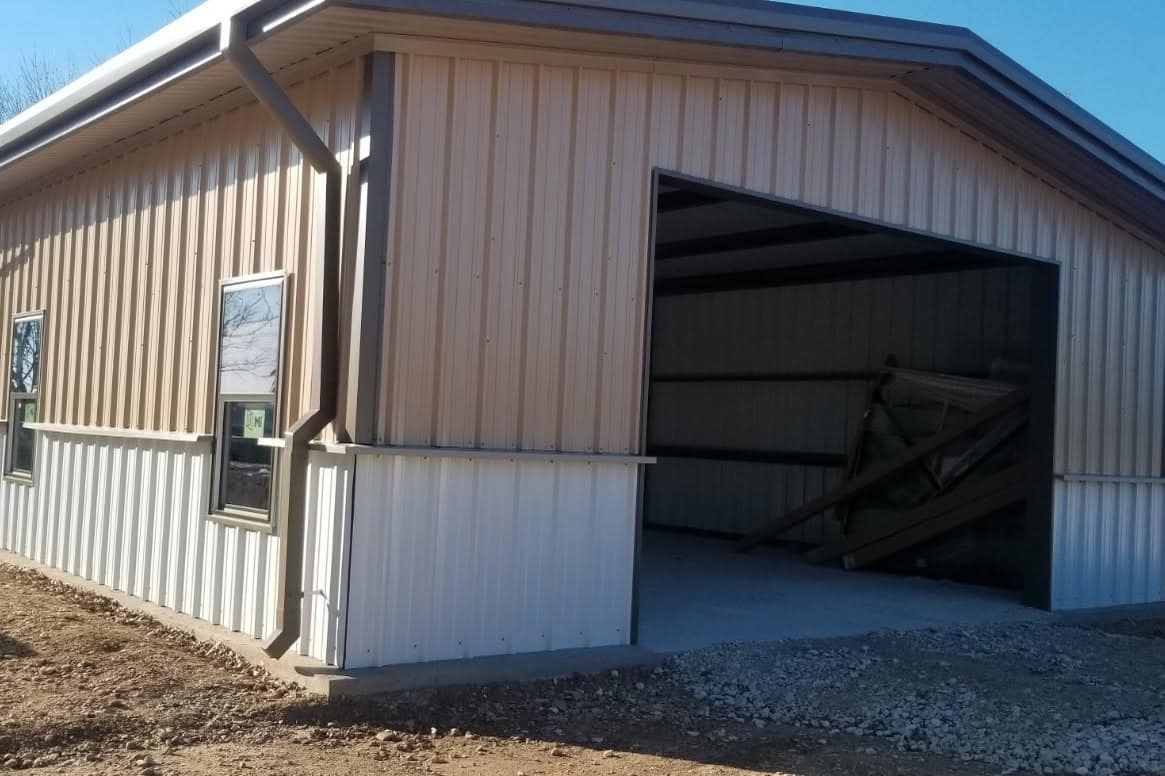 barndominium tan metal shop house open bay rural