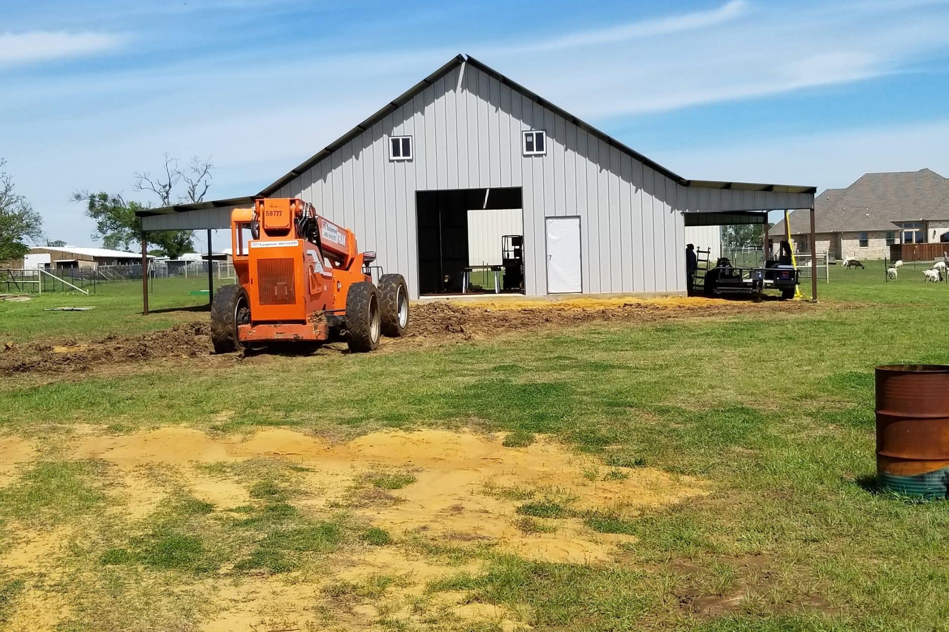 agricultural shop gray metal covered lean to both sides open bay