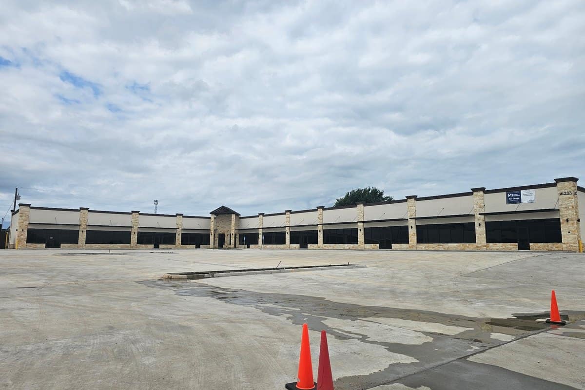retail strip center stucco stone storefront glass