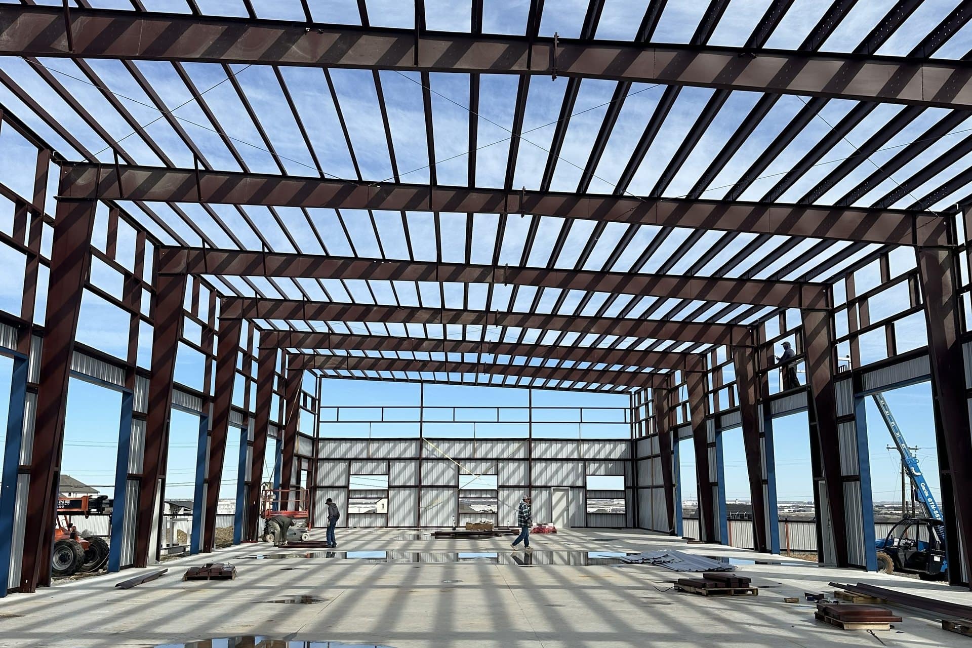 red iron frame interior purlins and rigid frames from the slab
