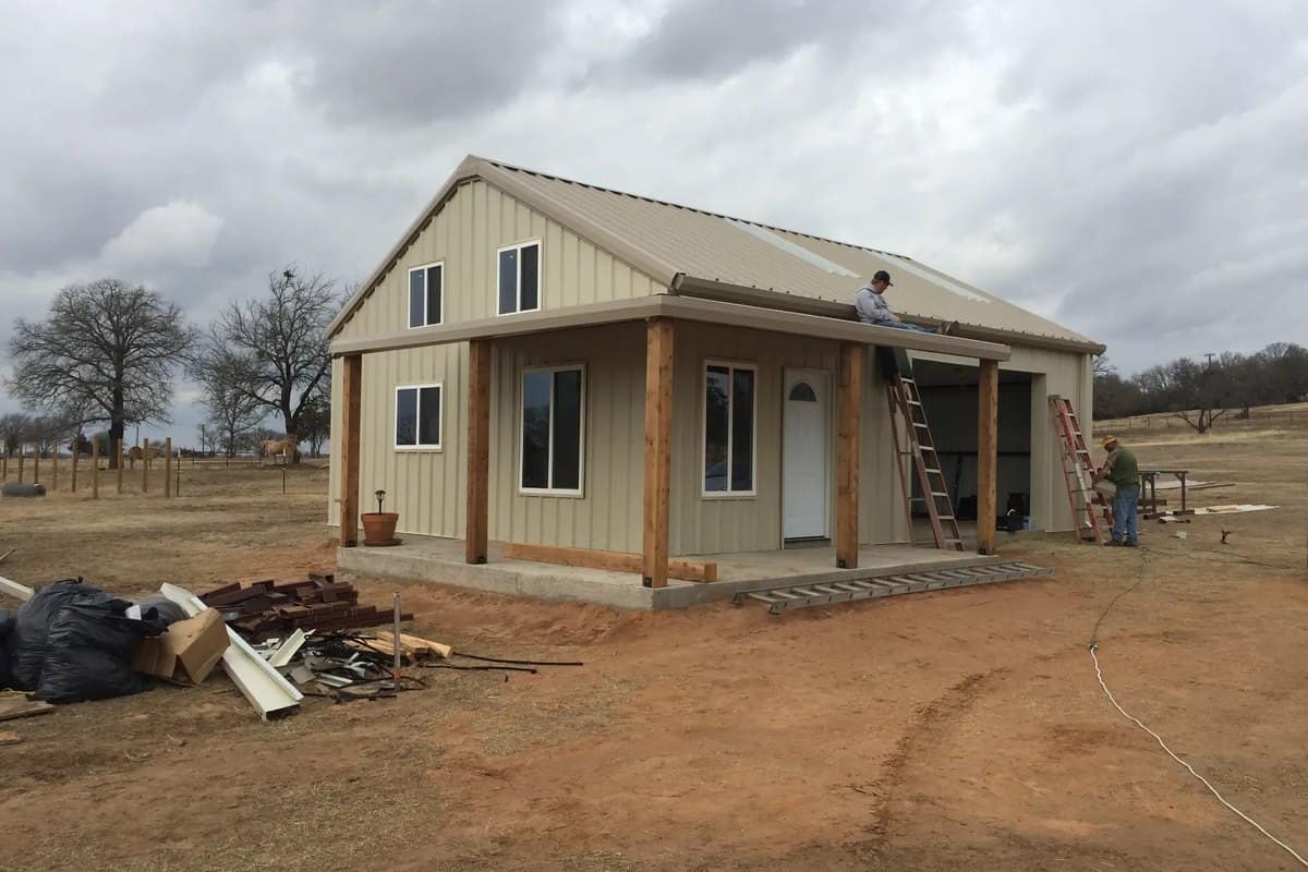 barndominium shell roof and porch framing crew working