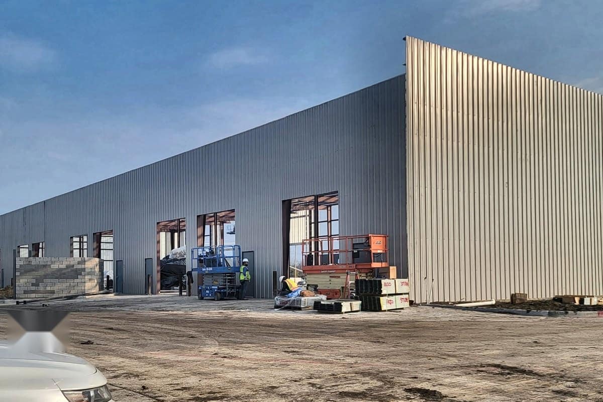 shell dried in storefront openings framed cmu and lifts on site