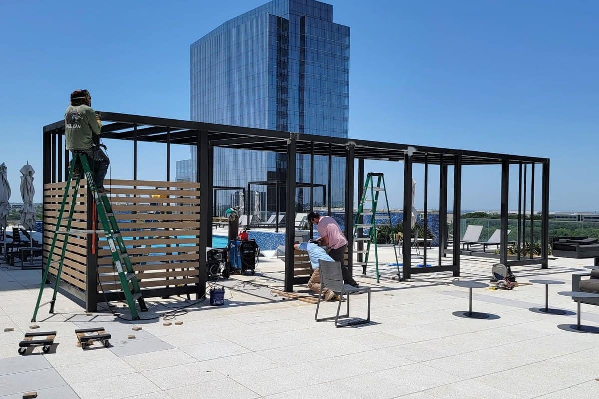 rooftop cabana steel frame welding crew in progress