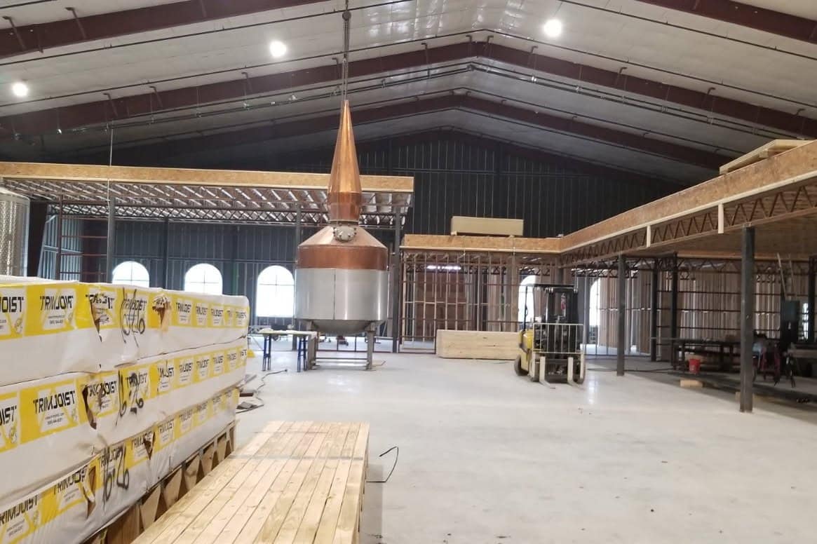 distillery interior copper still clear span frame mezzanine