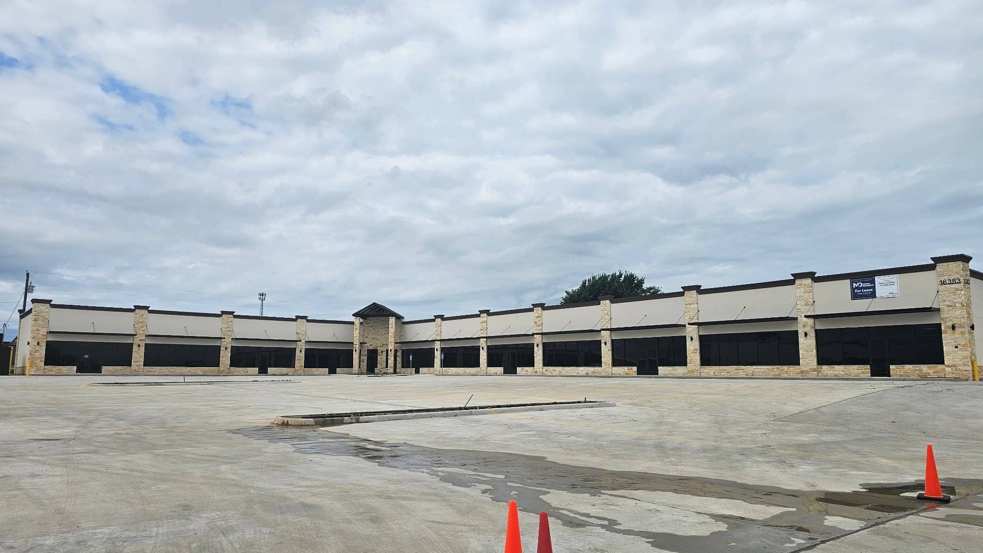 retail strip center stucco stone storefront glass