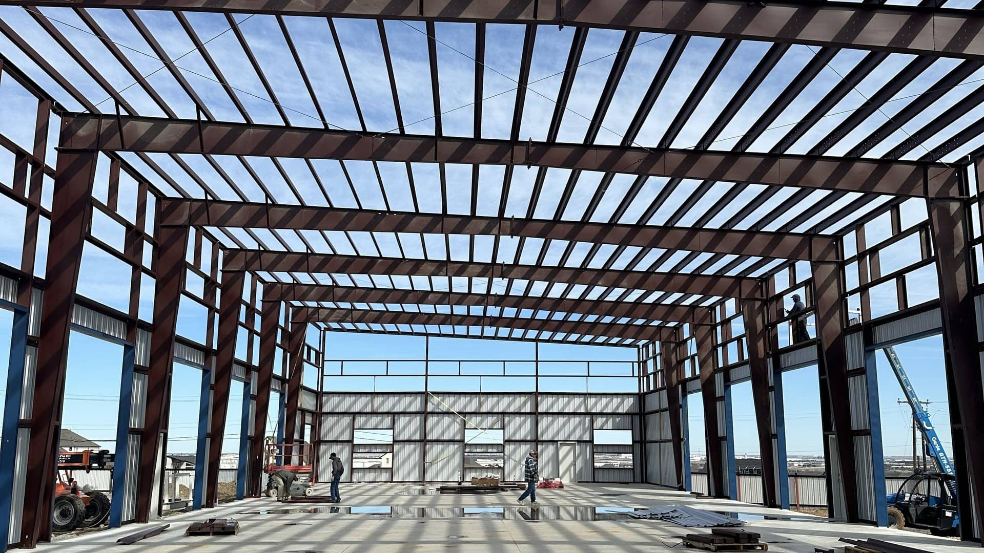 red iron frame interior purlins and rigid frames from the slab
